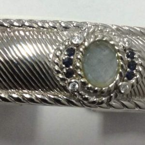 925 JUDITH RIPKA BANGLE W/BLUE STONE 84.7G