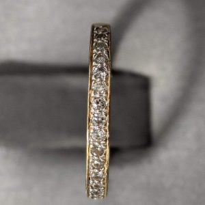 14K YELLOW GOLD AND COLORLESS DIAMOND HALF-ETERNITY BAND (20 PTS)(1.3 DWT)