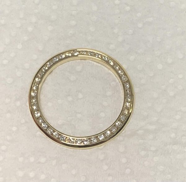 18K W/G LADIES DIAMOND BEZEL FOR A 26MM LADIES ROLEX, CONSISTING OF 1.00 CARAT OF CHANNEL SET ROUND BRILLIANT CUT ROUND DIAMONDS