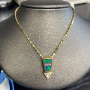 14K Y/G NECKLACE WITH OPAL & DIAMOND PENDANT .12PTS DIAMONDS. ON 18" CHAIN. 4.5 DWT.