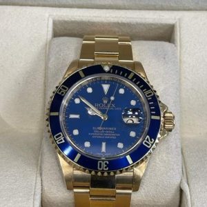 18K YELLOW GOLD ROLEX SUBMARINER BLUE DIAL BEZEL ENGRAVED SERIAL #D743901
