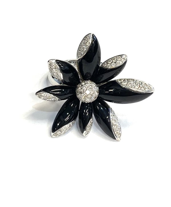 DIAMOND AND ONYX ASYMETRICAL FLOWER DESIGN RING